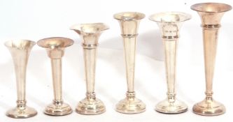 Group of six assorted hallmarked trumpet specimen vases with loaded circular bases, the tallest