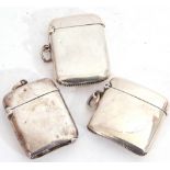 Mixed Lot: three hallmarked silver vesta cases of typical plain polished rectangular form, hinged