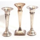 Group of three small early 20th century silver specimen vases with loaded bases including a pair,