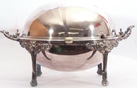 Early 20th century large silver plated bacon dish of oval domed form with hinged revolving lid, side