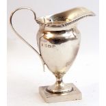 George V silver helmet shaped cream jug, reeded rim edge, plain loop handle on a square foot,