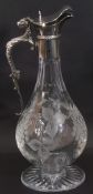Elizabeth II silver mounted cut glass claret jug, the decorative scroll handle with a beast thumb