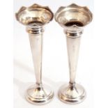 Elizabeth II pair of silver trumpet vases, flared rims with slender tapering bodies to a circular