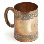 Victorian silver mug of tapering cylindrical form, engraved with a double frieze of leaves, the body