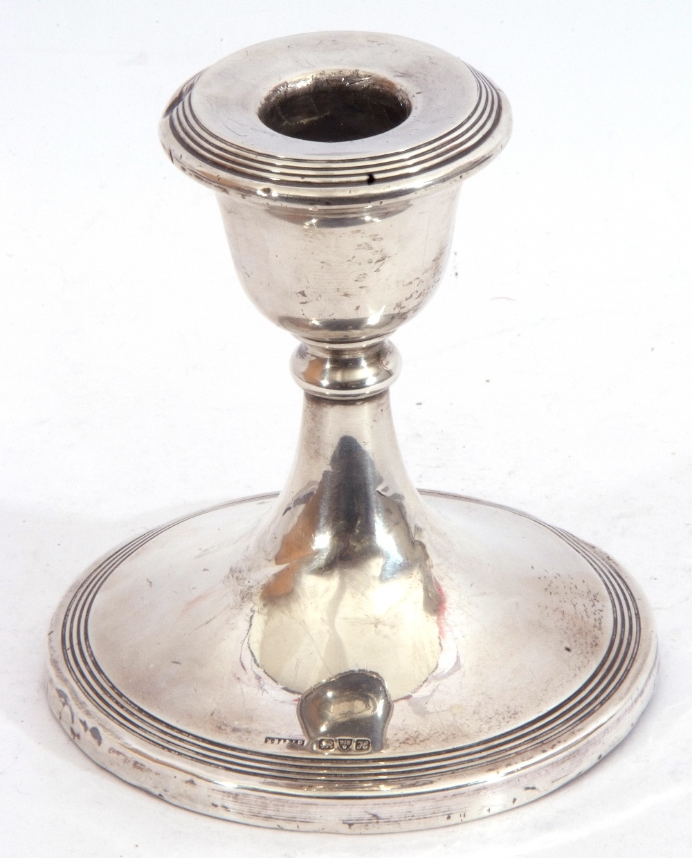 Edward VII dwarf candlestick, the circular body on a single knopped stem to a spreading base,