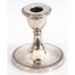 Edward VII dwarf candlestick, the circular body on a single knopped stem to a spreading base,