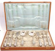 Art Deco period oak cased set of Continental silver/silver handled serving items including pair of