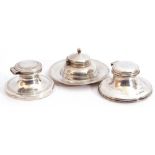 Mixed Lot: three silver capstan inkwells, each of typical form, hinged lids (loaded), London 1906,