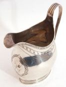 George III helmet cream jug with reeded rim and scroll handle, engraved garland and monogrammed