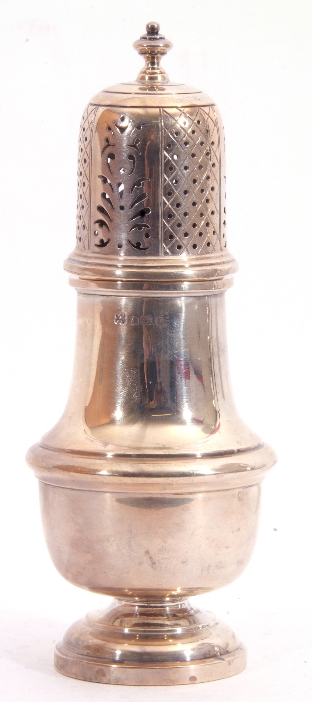 George V silver caster, plain polished baluster form, the pull off lid pierced with geometric