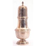 George V silver caster, plain polished baluster form, the pull off lid pierced with geometric