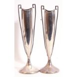 Pair of George V silver table flower vases having tall elongated shaped bodies with square cross