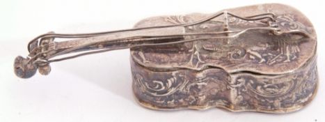 Edwardian import hallmarked lidded box in the form of a miniature cello, chased and embossed with