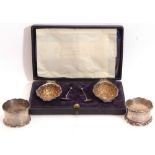 Mixed Lot: cased pair of late Victorian embossed oval two-handled salts with the remains of gilt