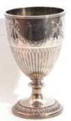 Late Victorian goblet shaped vase with embossed ribbon tie and garland frieze to top beneath a