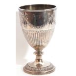 Late Victorian goblet shaped vase with embossed ribbon tie and garland frieze to top beneath a