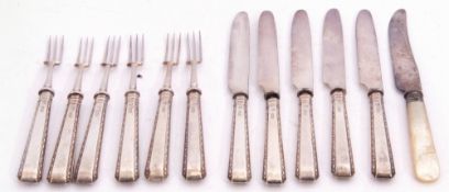 Set of six George V silver handled fruit forks with plated prongs, together with five matching