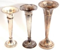 Mixed Lot: three silver trumpet vases, two tapering cylindrical designs and a panelled example,