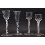 Group of 4 mid 18th century wine glasses, all with opaque/air twist stems, (4)