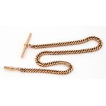 15ct Stamped watch chain, flattened curb link design, supporting a T bar and swivel clip, 32cm long,