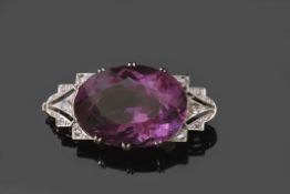 Art Deco style large amethyst and diamond brooch, the oval shaped faceted amethyst 25 x 20mm,