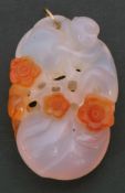 Vintage pink and orange jade pendant, a design featuring a monkey holding fruit and flowers, 5 x