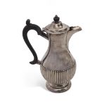Late Victorian hot water jug of circular baluster form with half fluted decoration, circular foot,