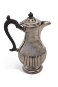 Late Victorian hot water jug of circular baluster form with half fluted decoration, circular foot,