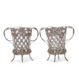 Unusual pair of glass lined Dutch 19th century silver vases with cast and pierced decoration and