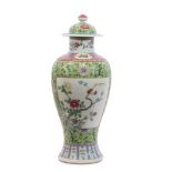 Chinese late 19th century vase and cover, the green ground with polychrome decoration of flowers