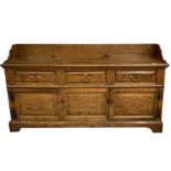 18th century oak dresser base with later tray top pediment, the frieze with three short drawers over