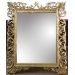 19th century carved Florentine gill framed wall mirror with bevelled central glass, 78cm wide