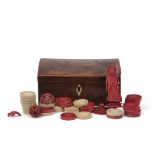 Antique small burr walnut domed lidded rectangular box containing assorted ivory and red stained