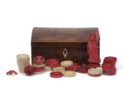 Antique small burr walnut domed lidded rectangular box containing assorted ivory and red stained