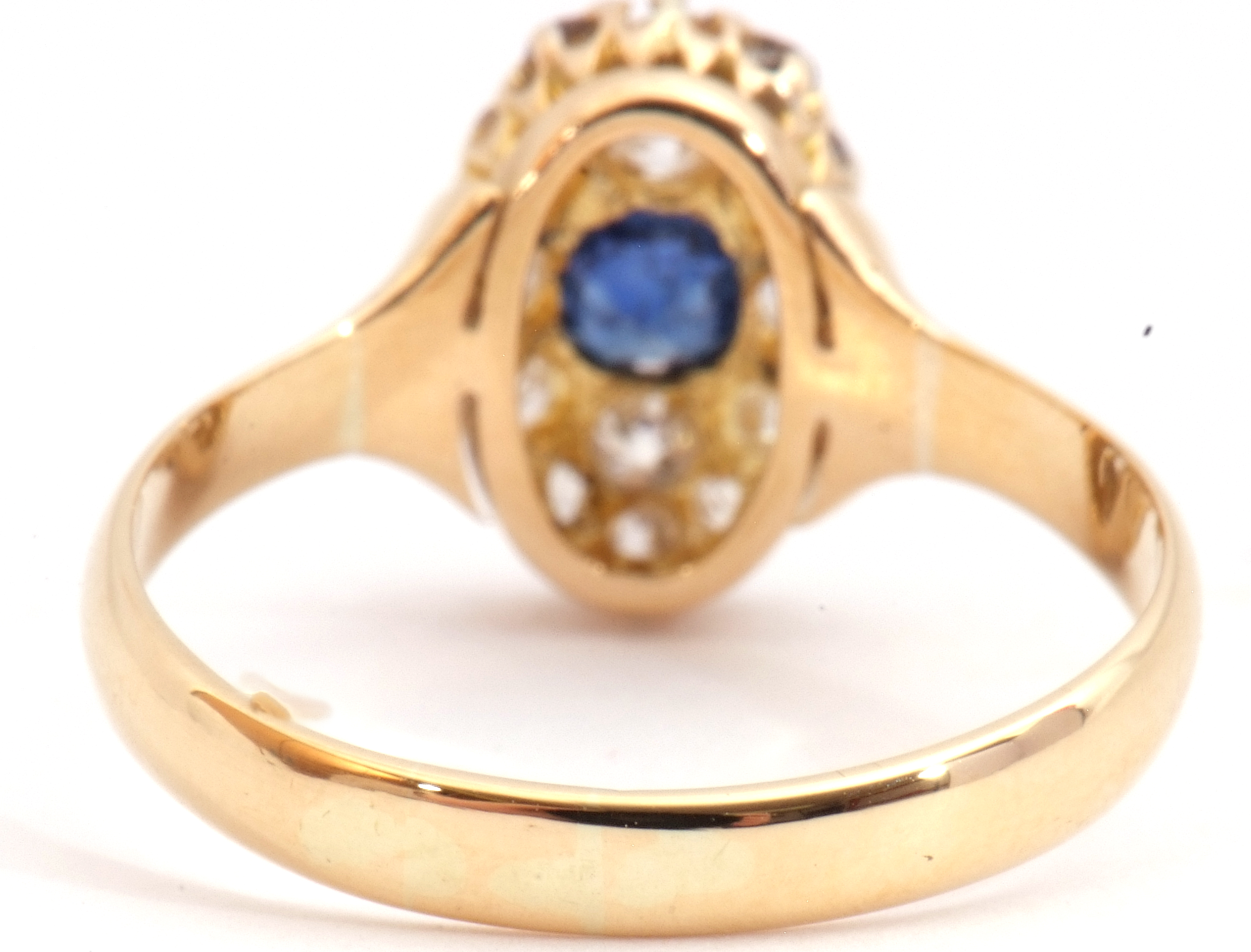 Sapphire and diamond cluster ring, the oval shaped design centring a round cut sapphire and 14 small - Image 6 of 8