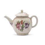 Lowestoft tea pot with floral decoration within gilt scroll panels, 14cm high