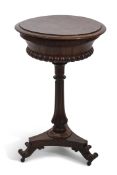 Victorian rosewood tepoy of circular form, the top with lifting lid enclosing two "of four" lidded