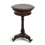 Victorian rosewood tepoy of circular form, the top with lifting lid enclosing two "of four" lidded