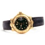 Tag Heuer 18ct gold Automatic watch, model WH234, serial number 1651, the dark green dial 19mm diam,
