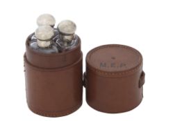 Leather travelling case with three silver topped spirit bottles, Charles Mappin, London 1914,