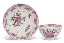 Lowestoft tea bowl and saucer circa 1780, the ribbed body with a floral design, saucer 12cm diam