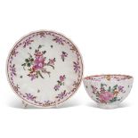 Lowestoft tea bowl and saucer circa 1780, the ribbed body with a floral design, saucer 12cm diam