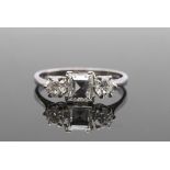 Diamond three-stone ring featuring a square step cut diamond, 1ct approx, flanked by two round