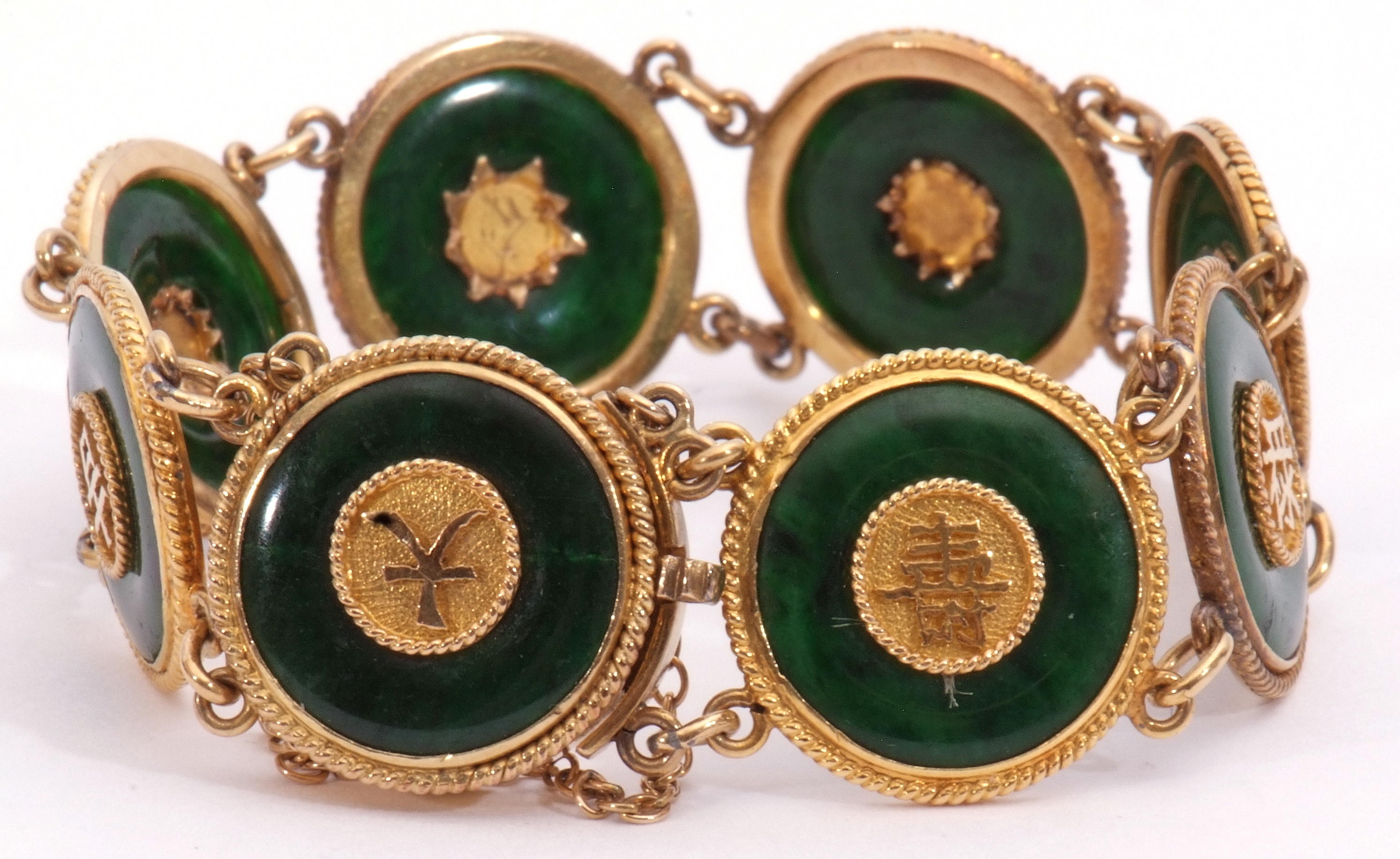 Chinese high grade yellow metal and jade bracelet comprising eight circular jade discs, each
