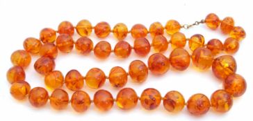 Vintage amber bead necklace, a single row of graduated slightly mis-shapen circular beads, 33cm