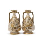 Pair of Royal Worcester aesthetic style vases, the white body with gilt prunus and floral decoration