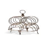 George III toast rack of five double entwined wire work bars to a shaped rectangular base and