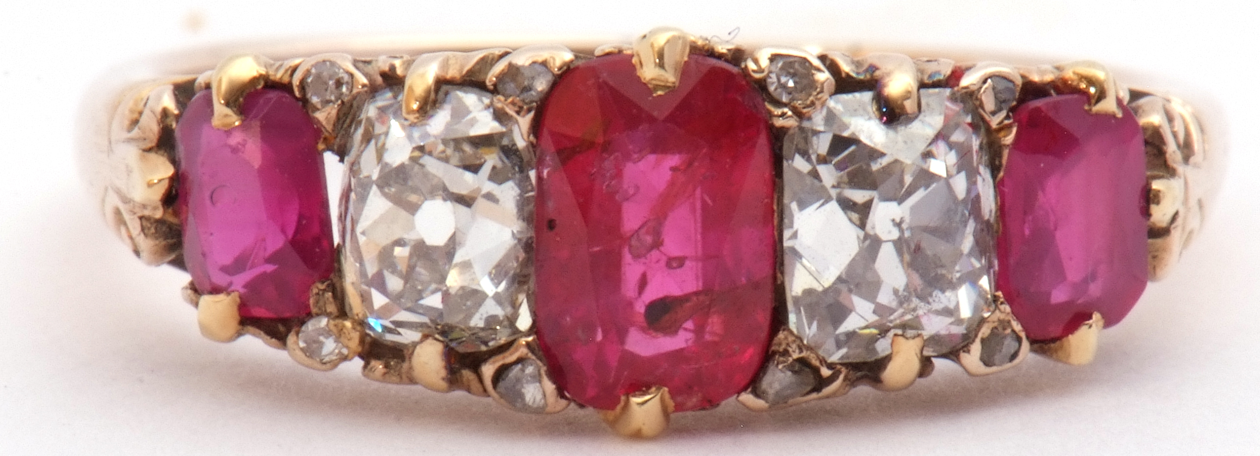 Ruby and diamond five stone ring, an alternate design featuring three graduated cushion cut rubies