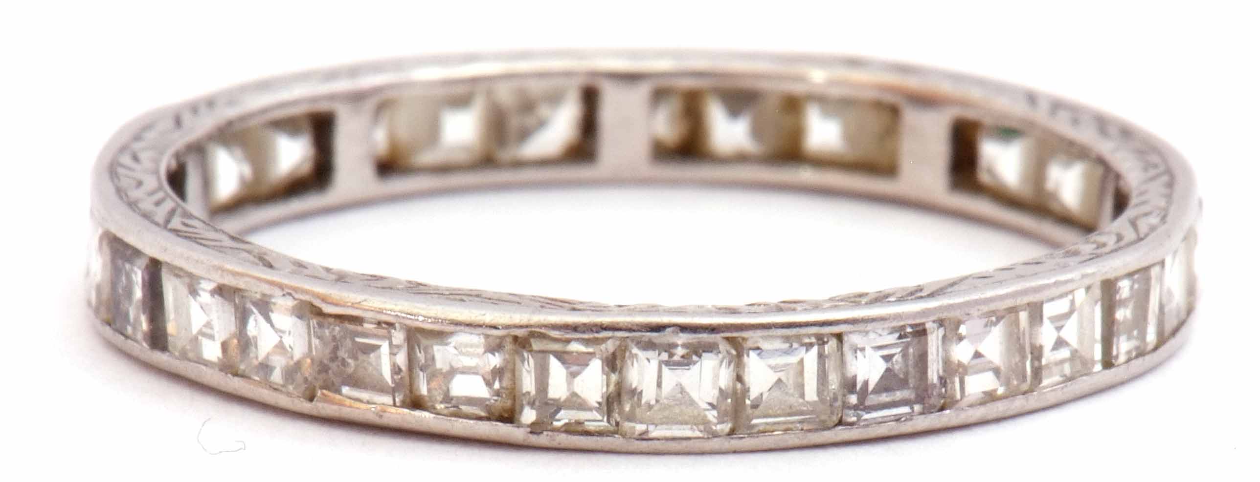 Precious metal and diamond set full eternity ring, a continuous band of small pave set square cut