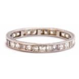 Precious metal and diamond set full eternity ring, a continuous band of small pave set square cut